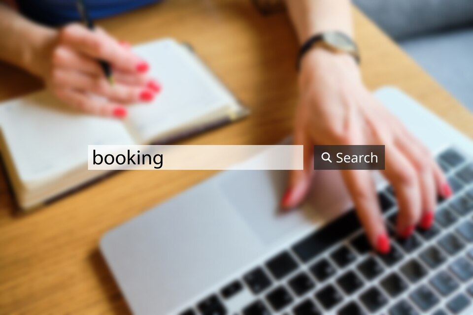 concept-booking-search-bar-background-businesswoman-with-laptop-large